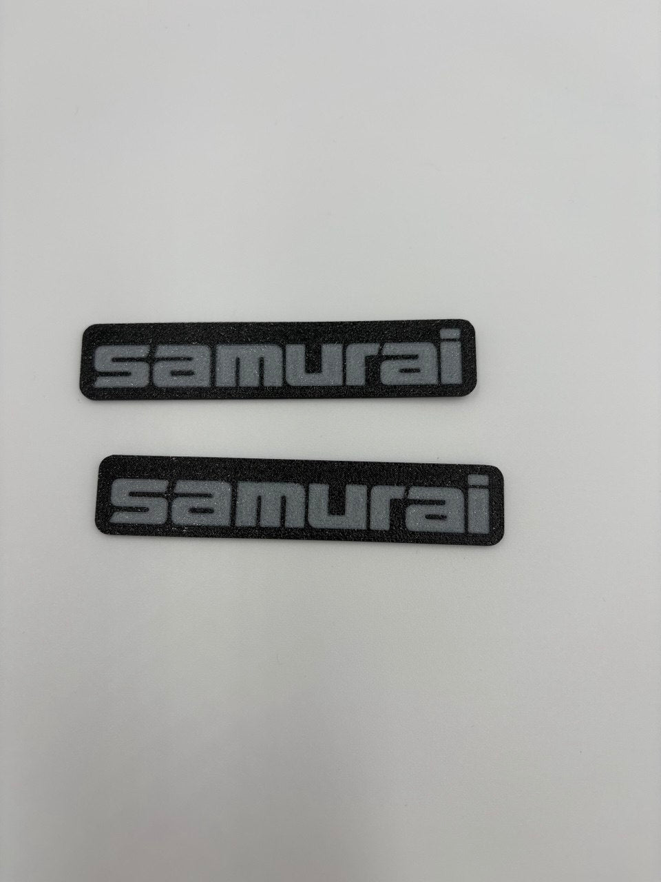 Coppia (2) di targhette laterali per Suzuki Samurai